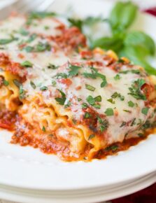 A close up of lasagna roll ups on a plate
