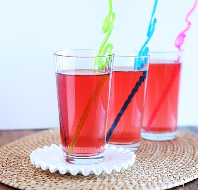 Fruit punch in a glass with a crazy straw