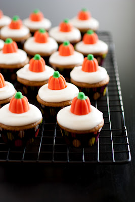 Mini pumpkin cream cheese cupcakes with pumpkin candy toppers
