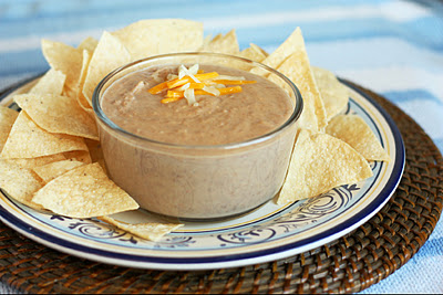 Cheesy refried bean dip with tortilla chips