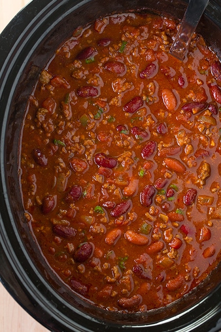 A close up of a bowl of slow-cooked chili