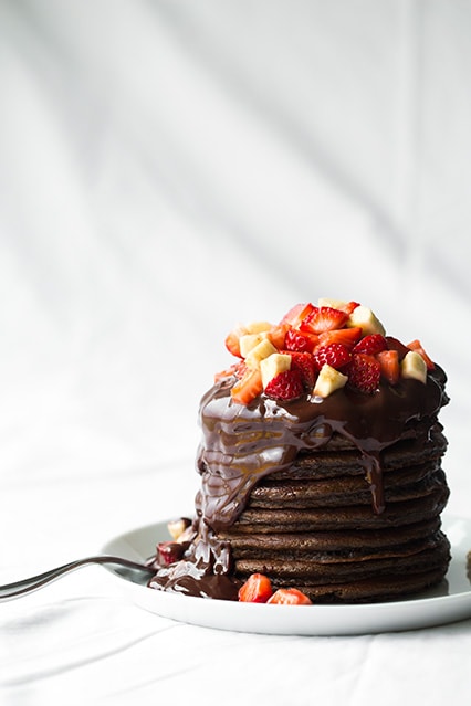 stack of Chocolate Pancakes on white plate