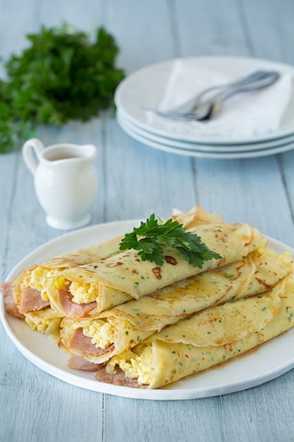 herb crepes with eggs, swiss, ham and browned butter