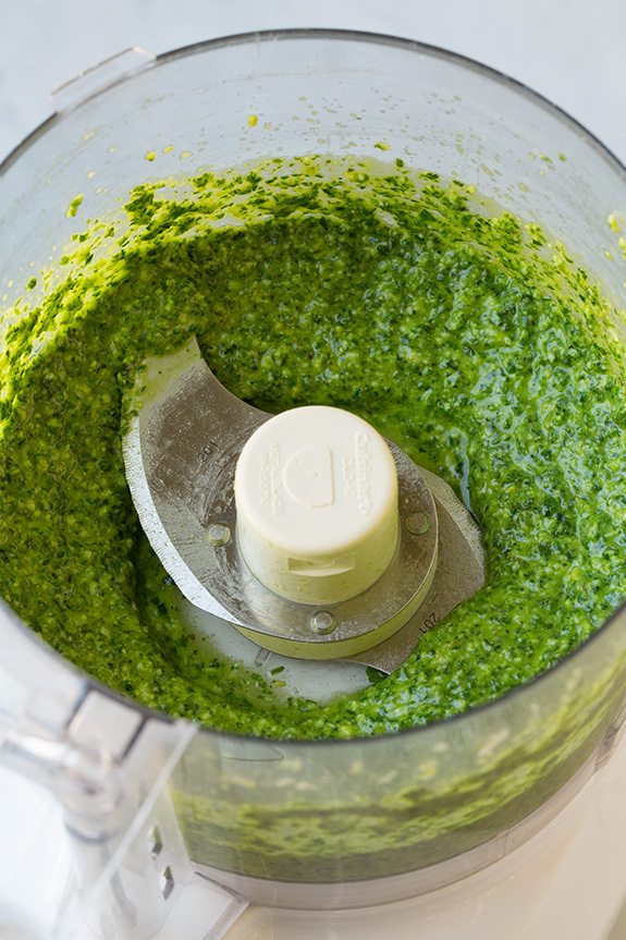 finished Basil Pesto in bowl of food processor 
