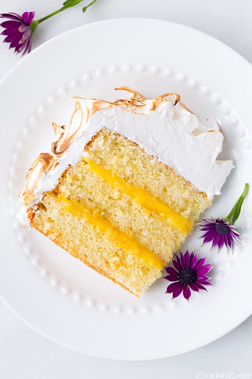 slice of orange chiffon cake on a white plate