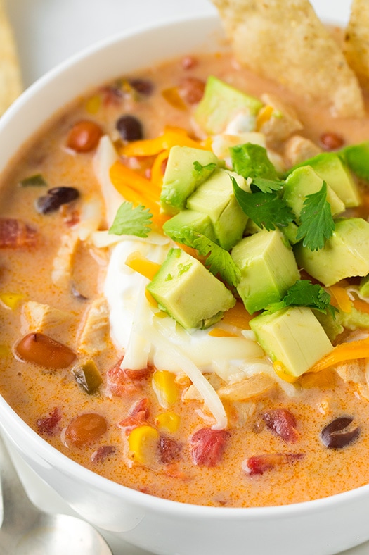 A close up of Creamy Chicken Tortilla Soup topped with avocado