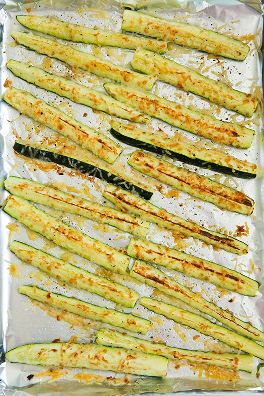 Oven Roasted Zucchini With Parmesan and Garlic Seasoning on a baking sheet