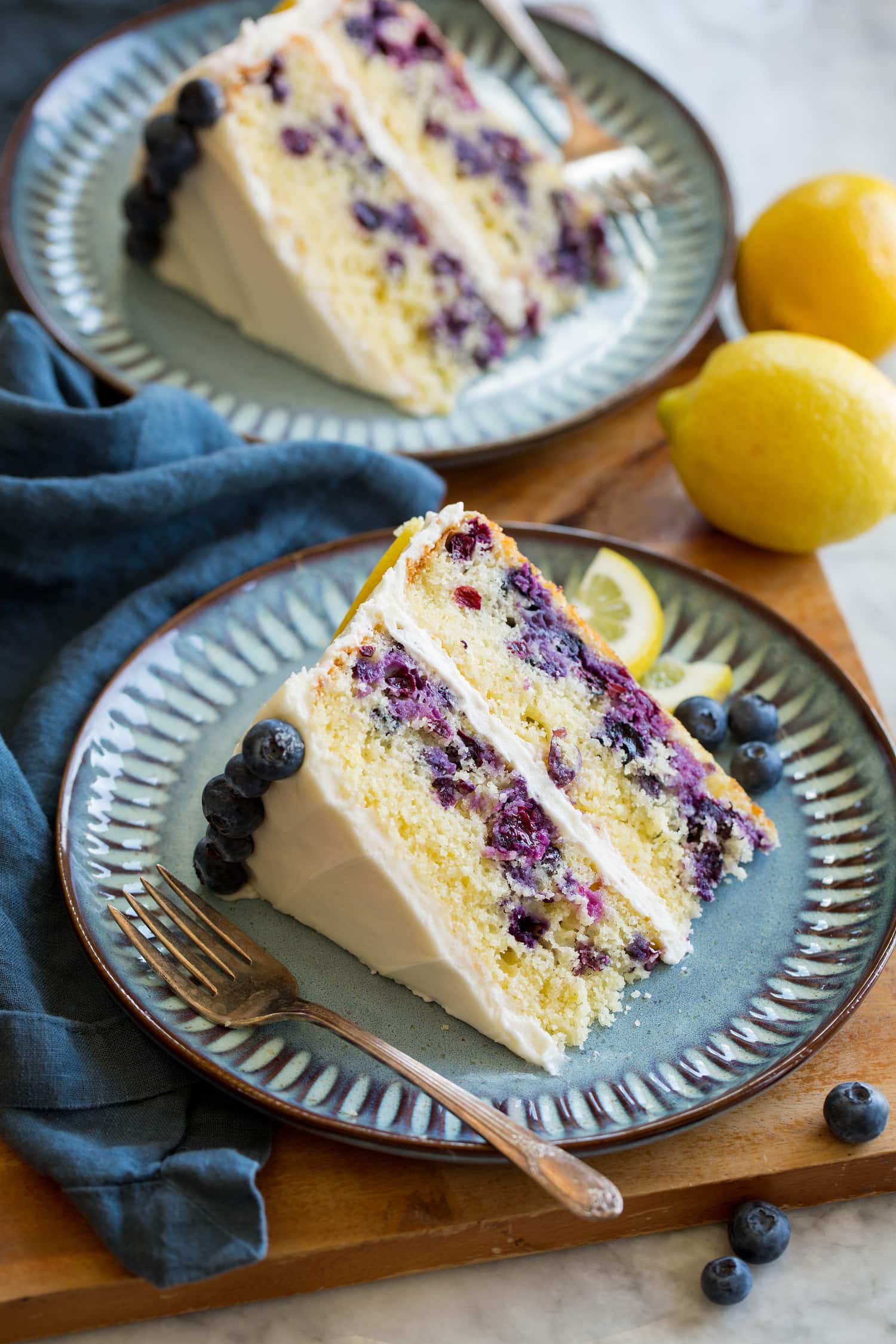 Two slices of homemade blueberry and lemon cake.