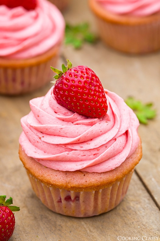 A close up of Strawberry Cupcakes with Strawberry Buttercream Frosting 