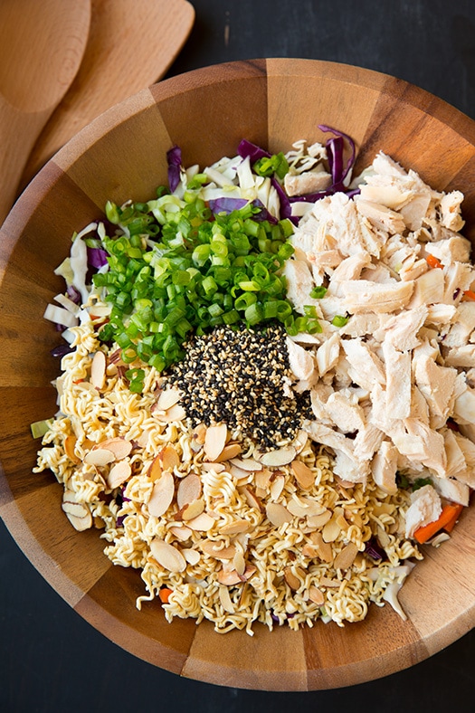 asian salad ingredients in large wooden bowl
