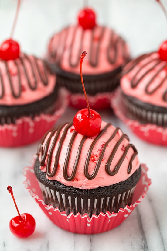 Miniature Chocolate Cherry Cupcake In An Red Paper Cup On A Plate With A Fork 