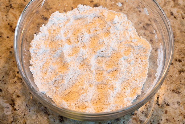 Making dough for Cannoli shells in glass mixing bowl