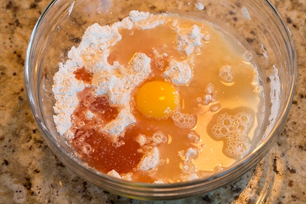 Adding eggs to cannoli shell dough