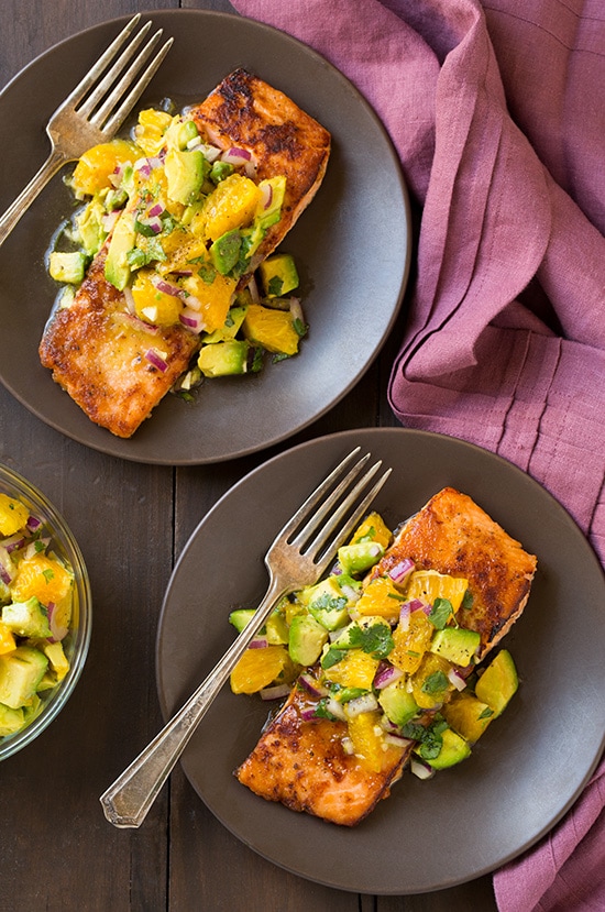 two gray plates topped with Honey Glazed Salmon and Avocado Salsa