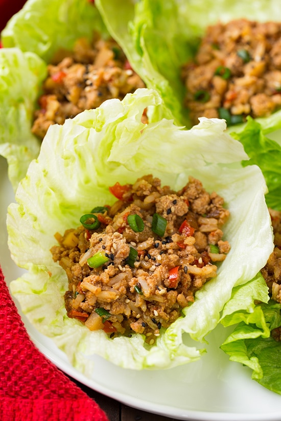 A close up of Slow Cooker Asian Chicken Lettuce Wraps on a white plate