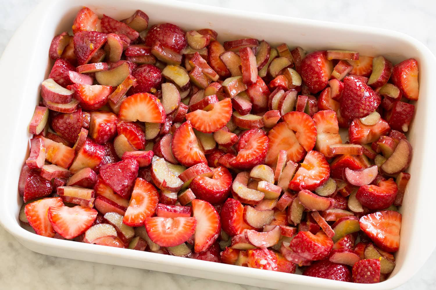 Strawberry rhubarb mixture in baking dish.