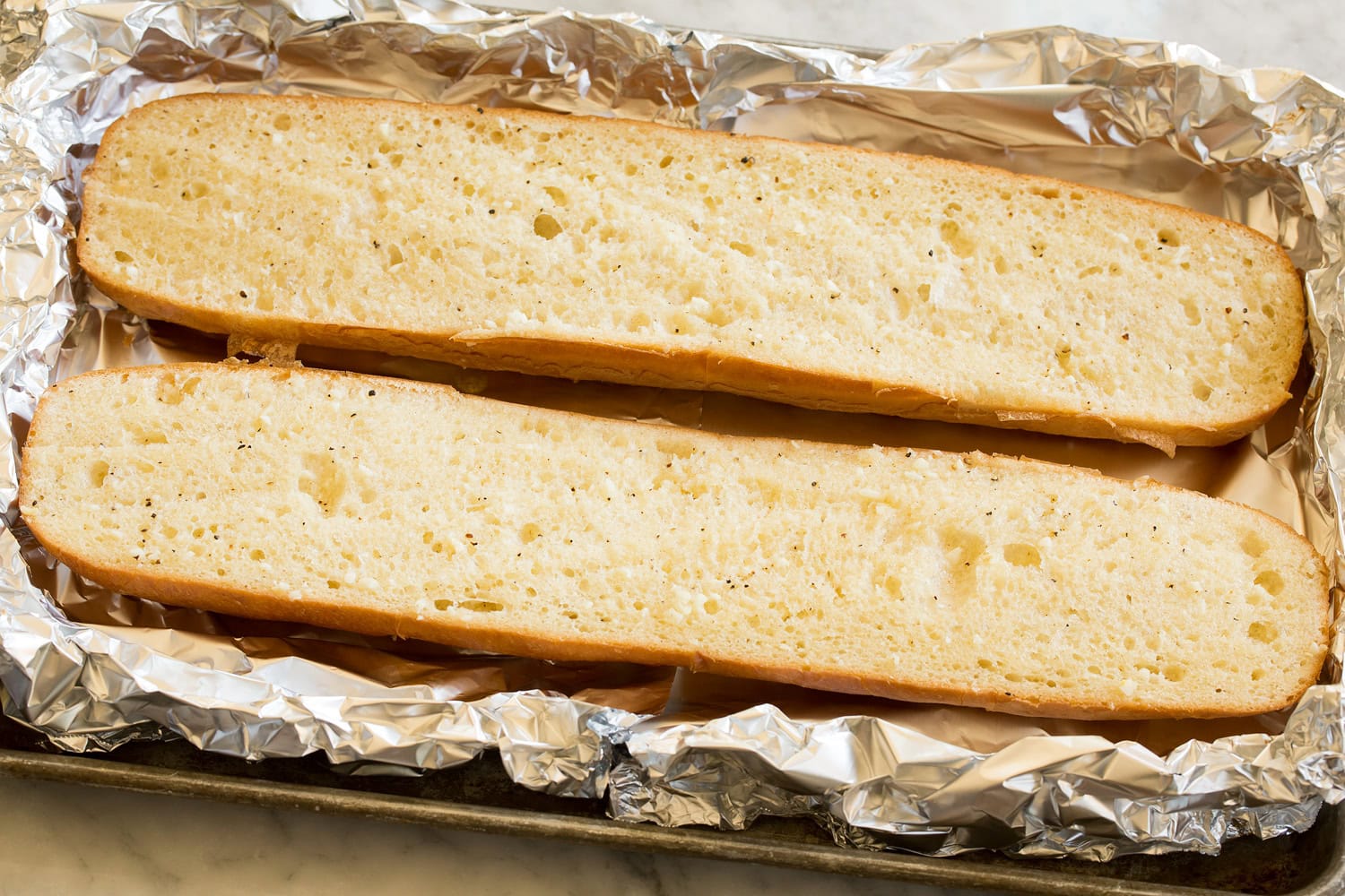 French bread halves toasted with butter.
