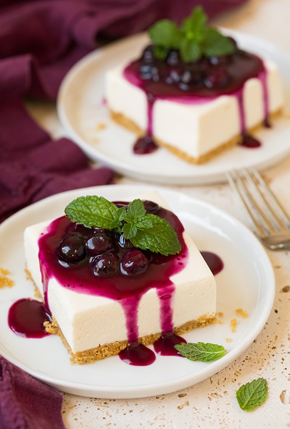 Two servings of no bake cheesecake on dessert plates.