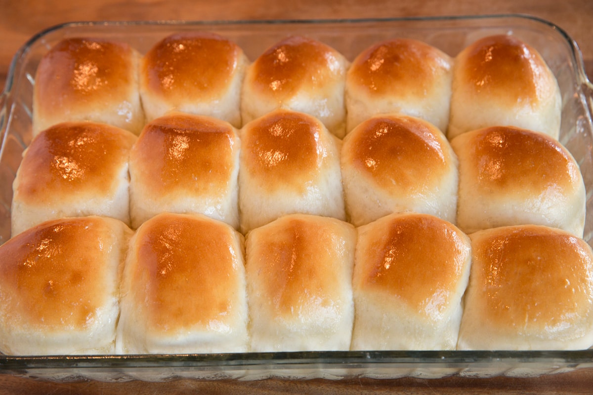 Dinner rolls after baking and brushing with butter.