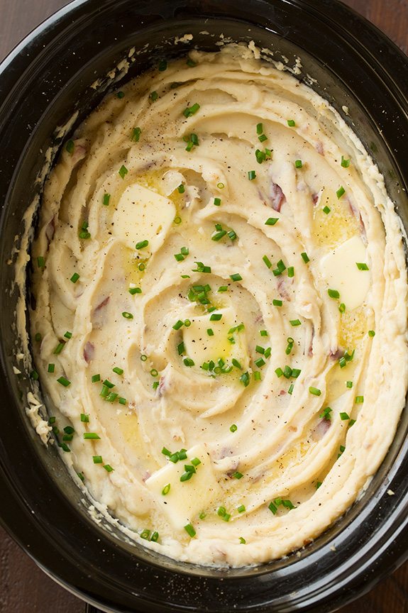 Overhead image of mashed potatoes in a slow cooker. 