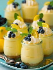 Lemon mousse in glass jars with whipped cream