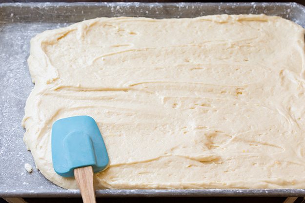 spreading cake batter into pan