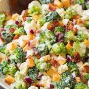 A close up of a broccoli and cauliflower salad in a bowl