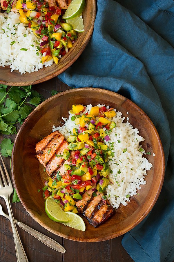 salmon with mango salsa and Coconut Rice in wooden bowl