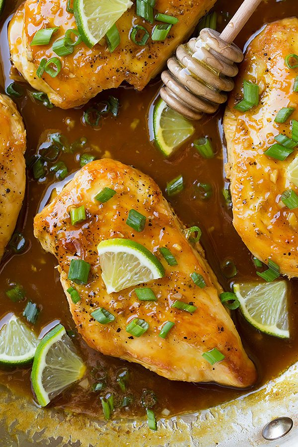 Chicken breasts with honey lime glaze in a skillet after cooking.