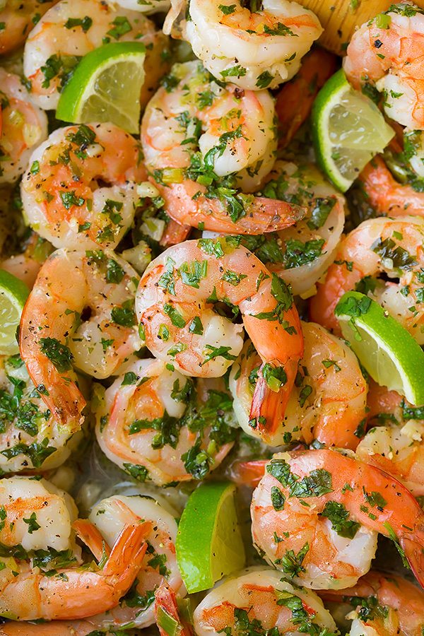 close up of Cilantro Lime Shrimp with lime wedges