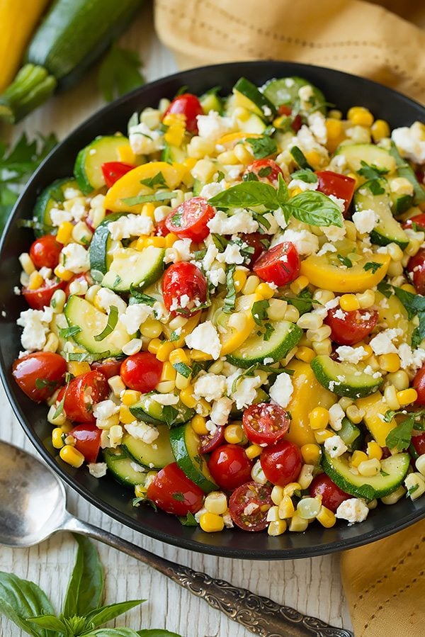 Salad with sauteed zucchini, squash and corn. Tossed with fresh tomatoes, feta, lemon and herbs.