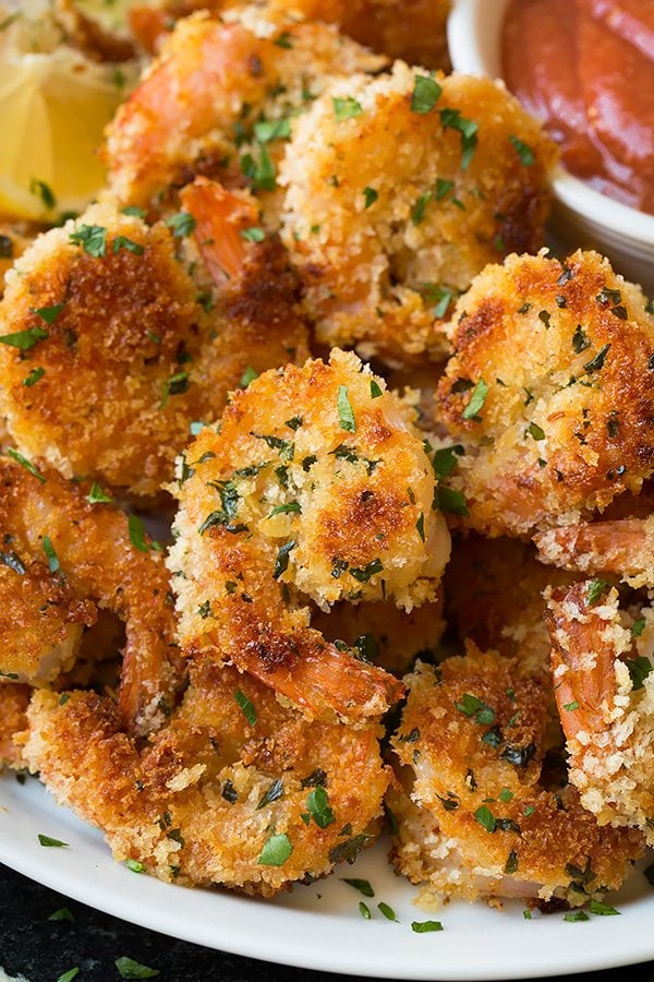 Close up image of panko crusted shrimp that's been cooked in a skillet.