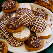 Pumpkin cookies with chocolate and vanilla icing.