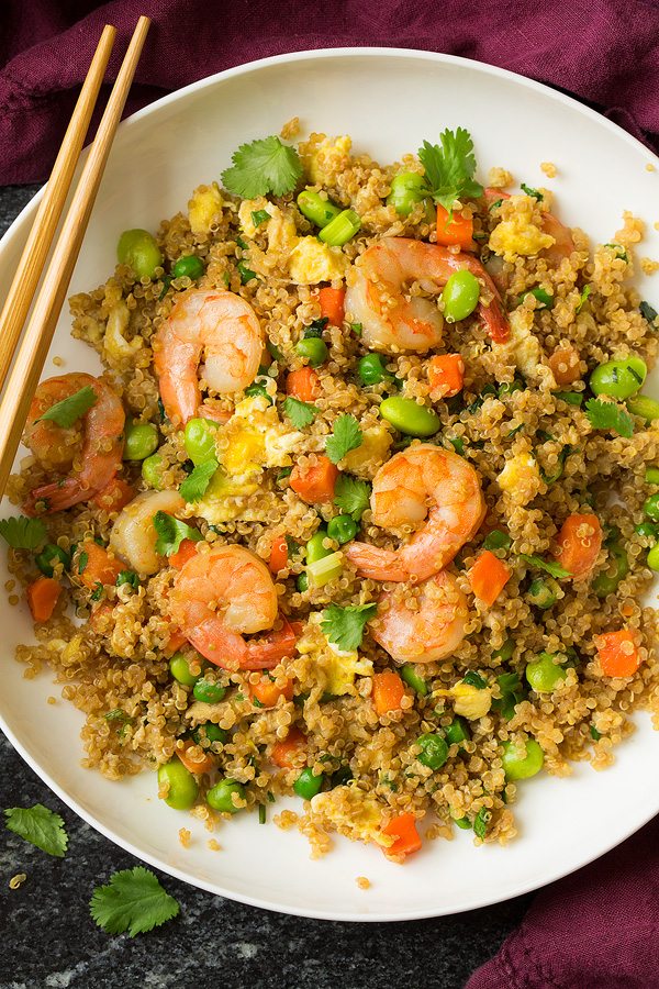 Shrimp fried rice with quinoa in a white serving bowl.