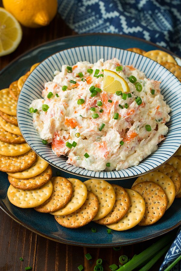 Smoked Salmon Dip salmon dip in a serving bowl with a plate of crackers.