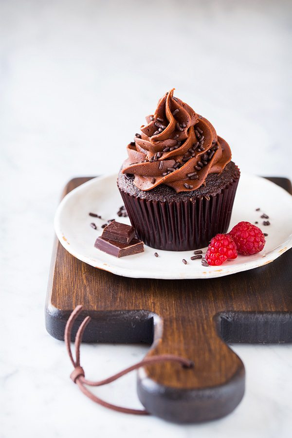 Perfect cupcake frosting on plated chocolate cupcake