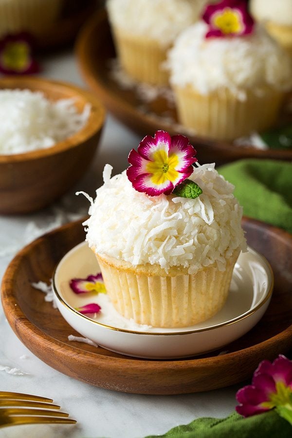 Coconut Cupcake with coconut buttercream frosting on plate