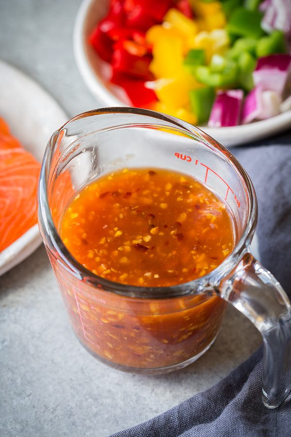 Measuring Glass filled with homemade Sweet and Sour Sauce