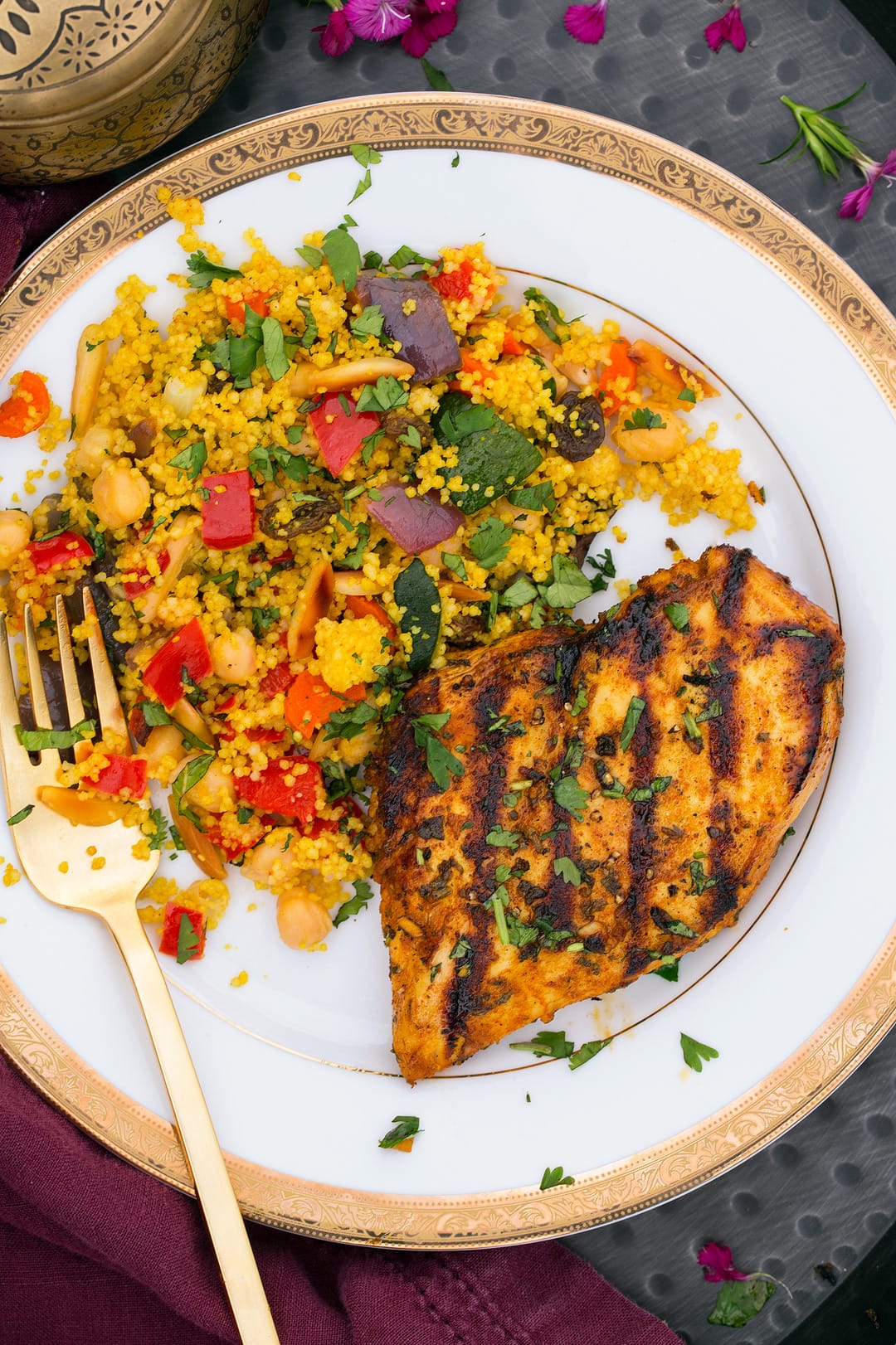 Grilled Moroccan Chicken on a plate with salad