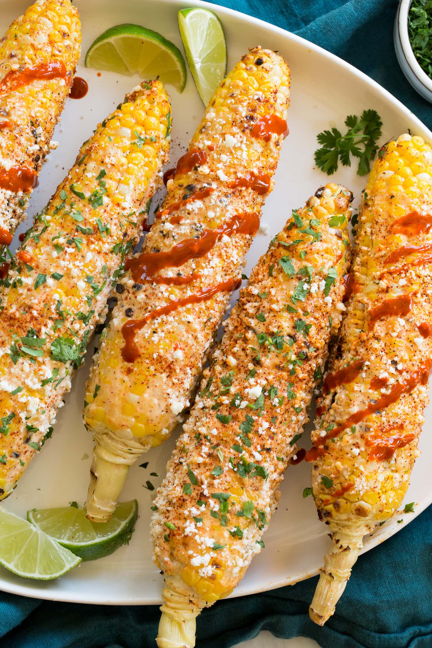 Elotes finished with mayonnaise, crema, cotija, cilantro and Mexican hot sauce.