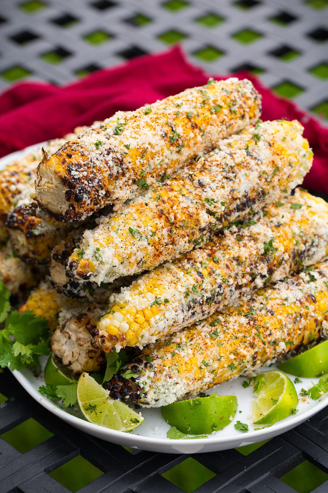 Stack of Mexican street corn on a plate.