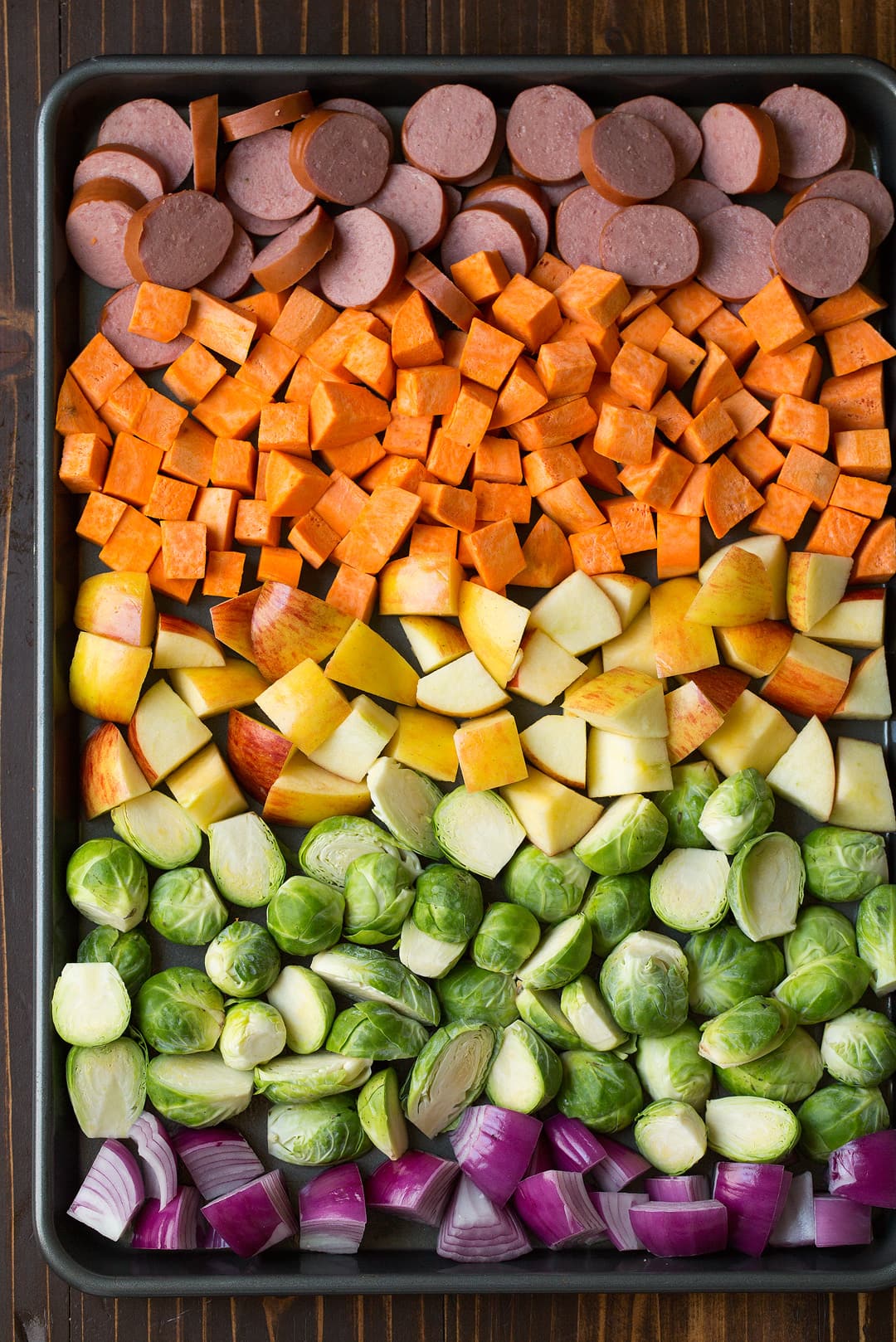 Sheet Pan Dinner with Turkey Sausage Sweet Potatoes Brussels Sprouts Apples and Red Onions