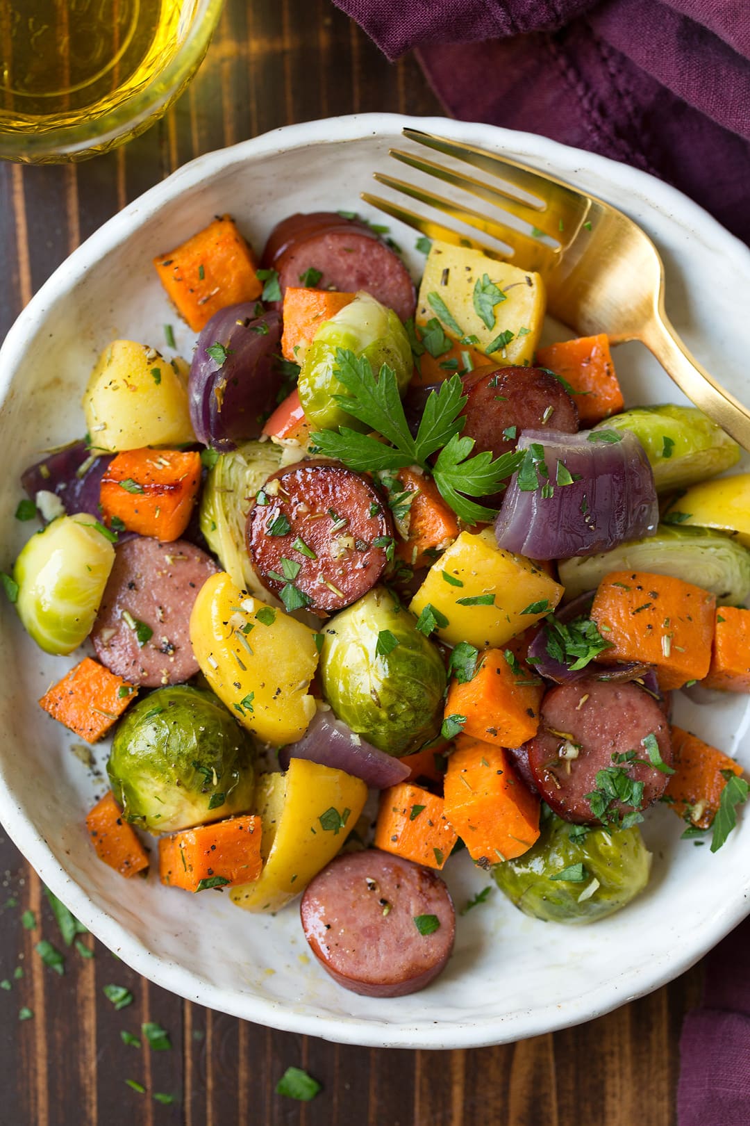 Sheet Pan Dinner with Turkey Sausage Sweet Potatoes Brussels Sprouts Apples and Red Onions Fall Dinner Idea