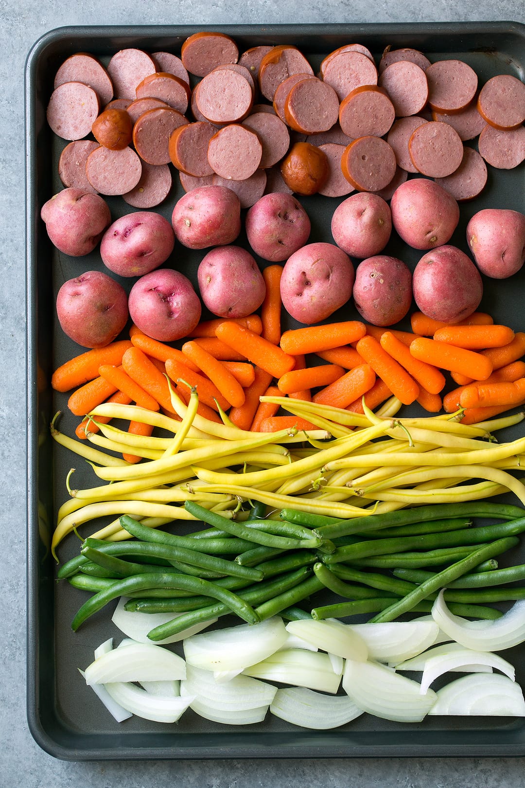 Easy Sausage and Veggie Foil Packs mixture on sheet pan