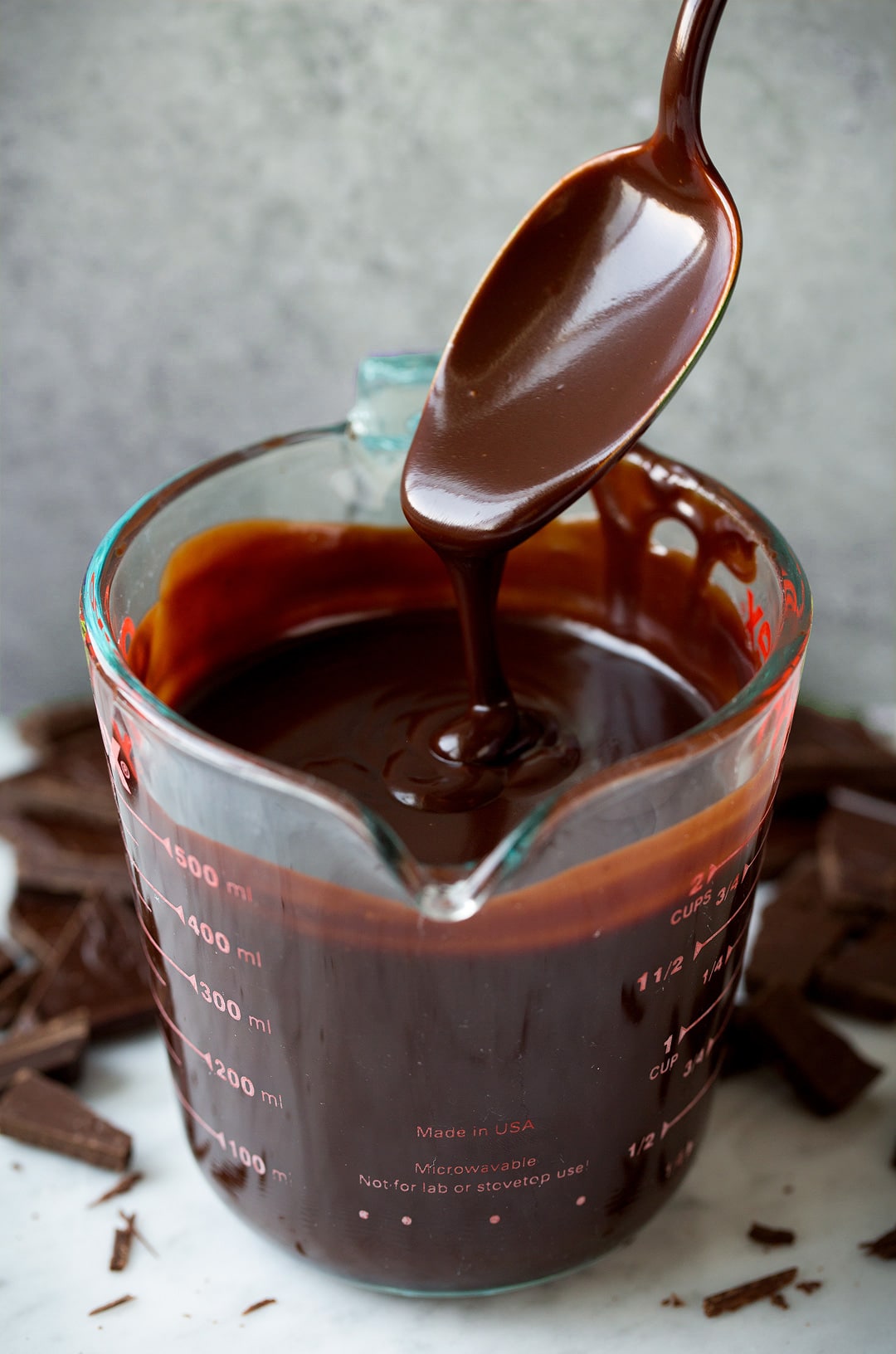 Hot Fudge Sauce in glass measuring cup 
