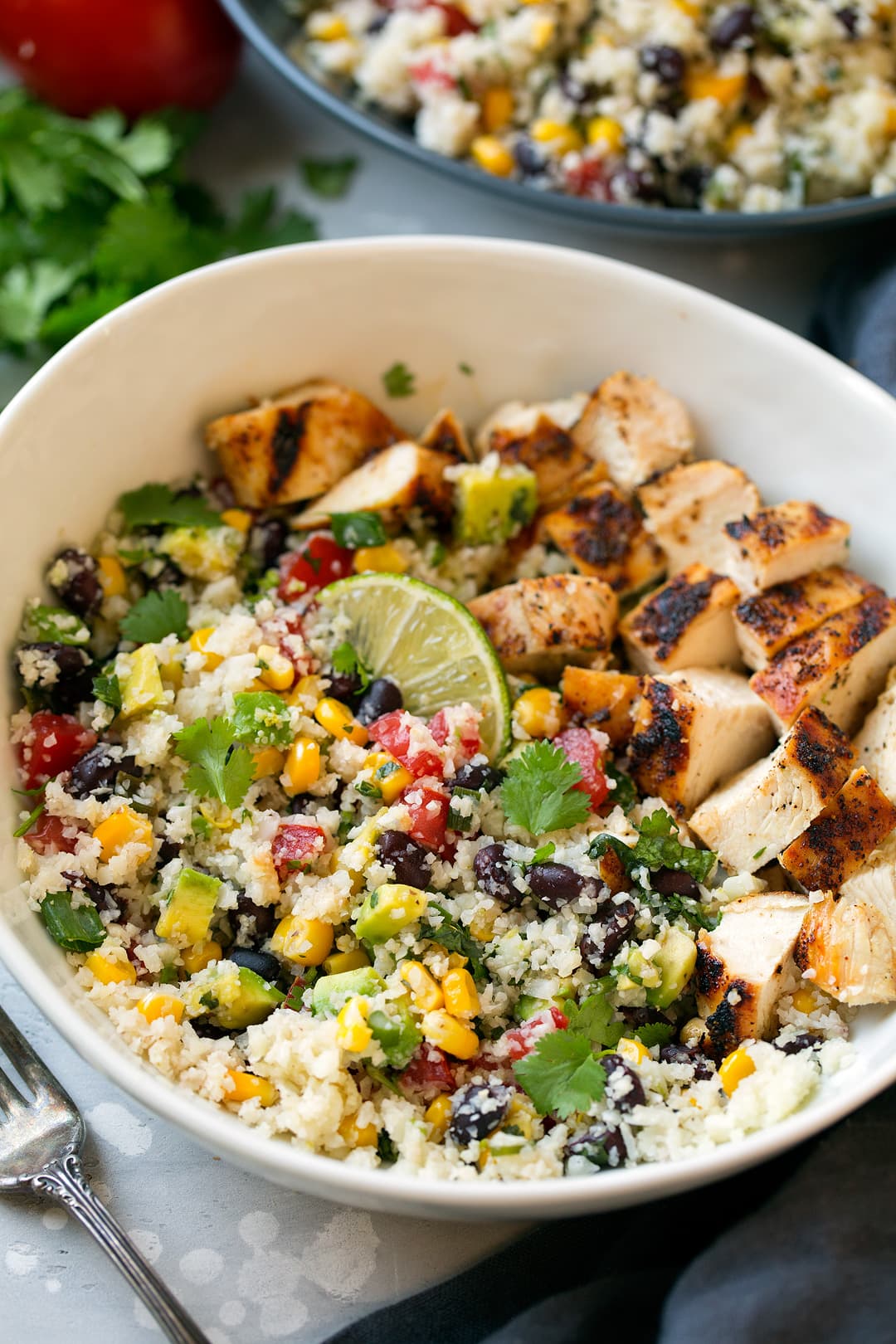 Cauliflower rice with added chicken, veggies and black beans. Seasoned with cilantro and lime.
