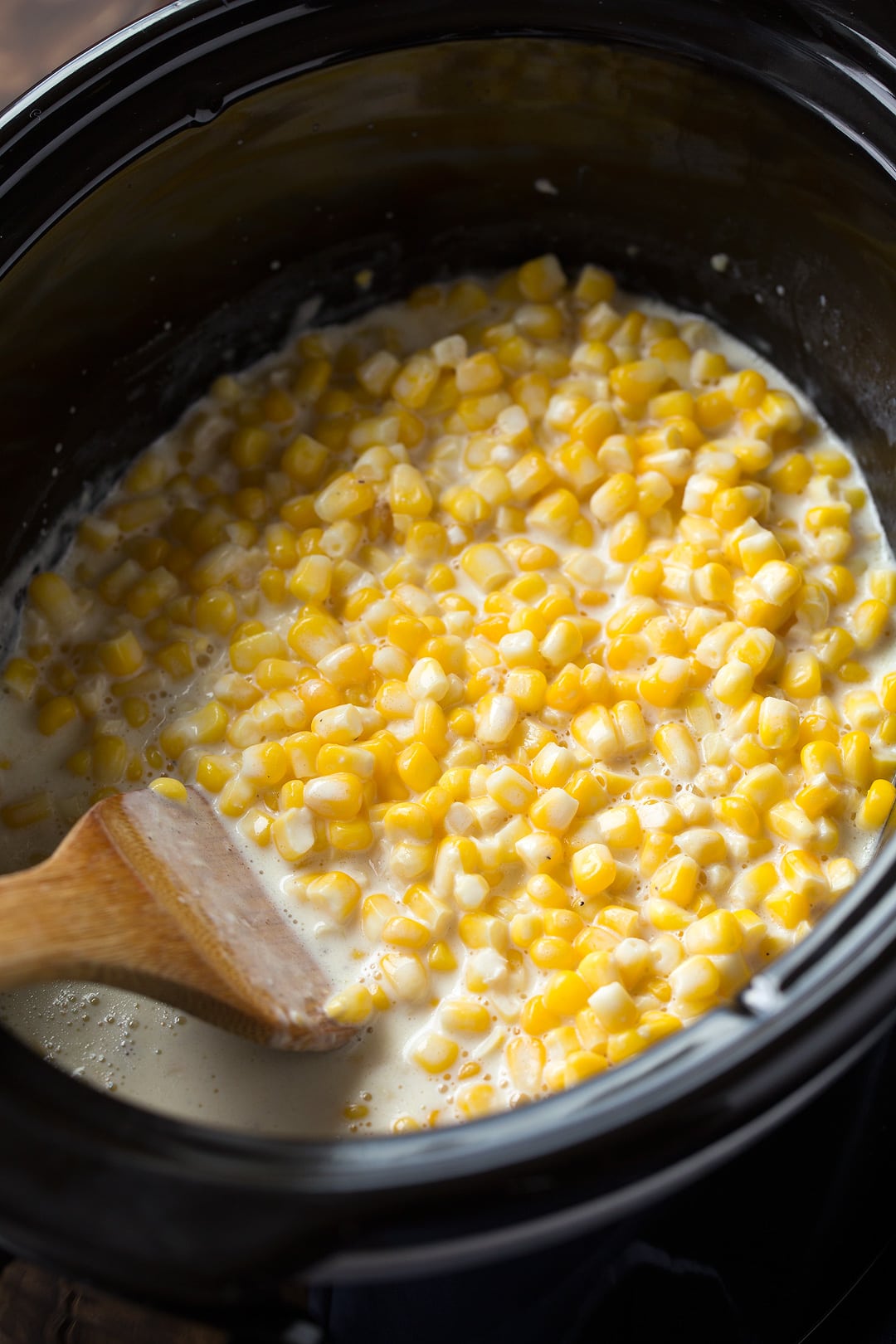 Creamed corn in a slow cooker after cooking.