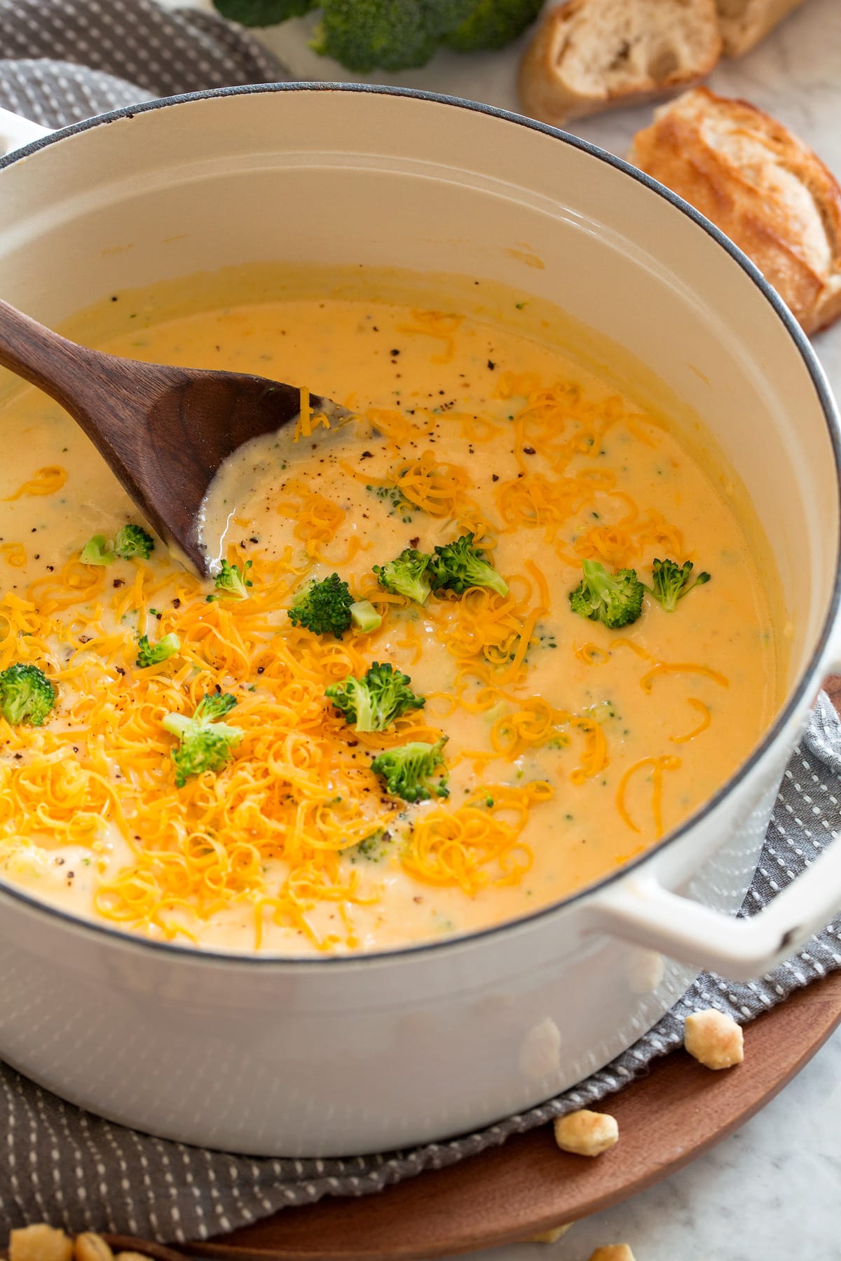 White pot full of broccoli cheese soup.