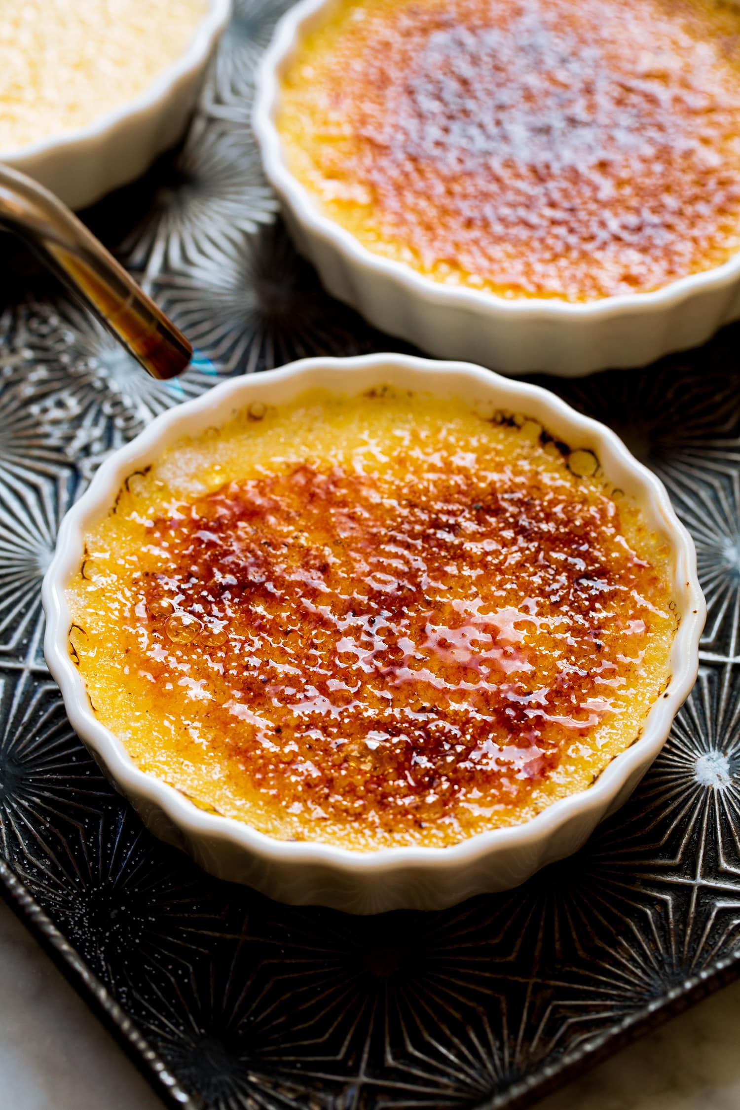 Creme brûlée sugar being caramelized with a torch.