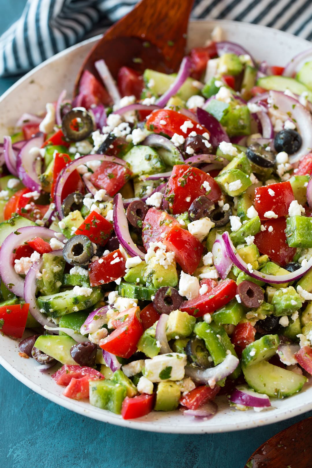 Close up photo of a Greek Salad in a white bowl
